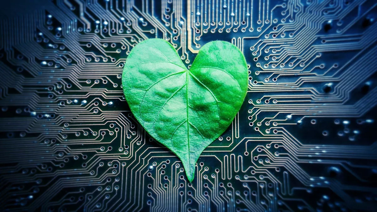 Heart-shaped plant leaf on circuit board